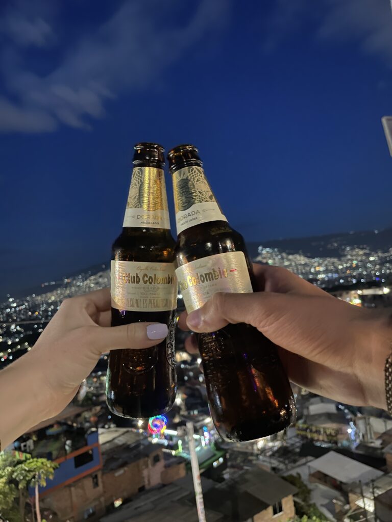 How to Spend 3 Days in Medellín, Colombia (2026 Itinerary) beers at a bar in comuna 13, medellin