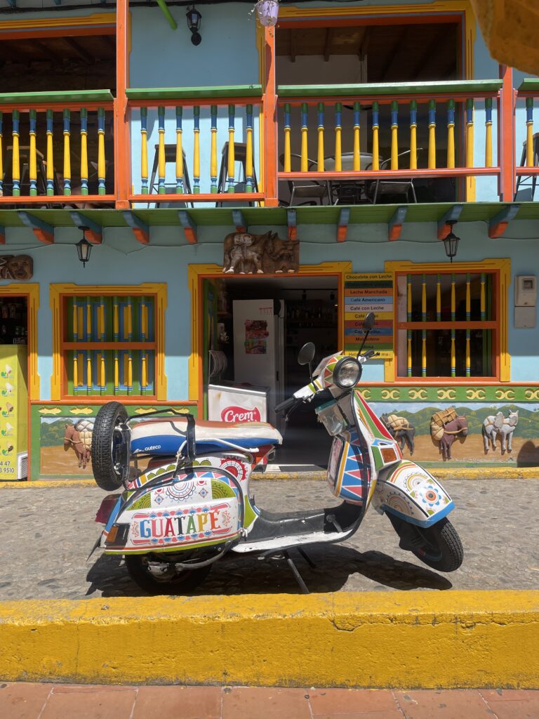 Is Guatapé Worth It in 2026? My Honest Guatapé Day Trip Review guatape vespa bike scooter colombia