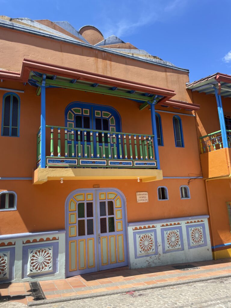 Is Guatapé Worth It in 2026? My Honest Guatapé Day Trip Review orange house in guatape colombia
