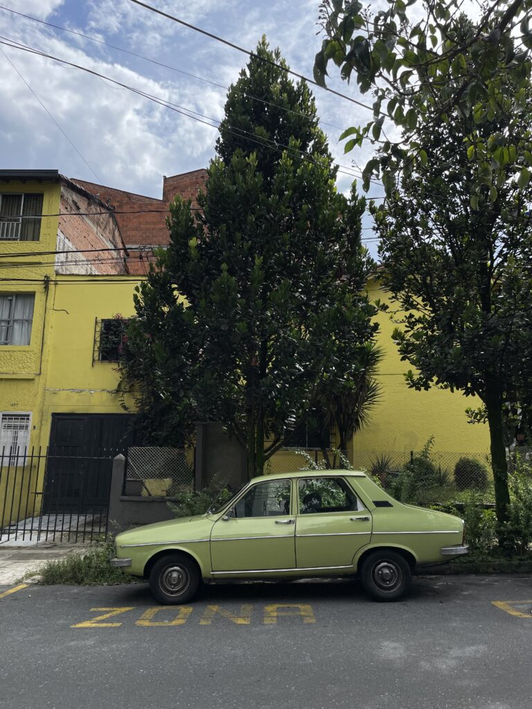 Where to Stay in Medellín: The Best Neighbourhoods for Every Kind of Traveller old green car in laureles medellin