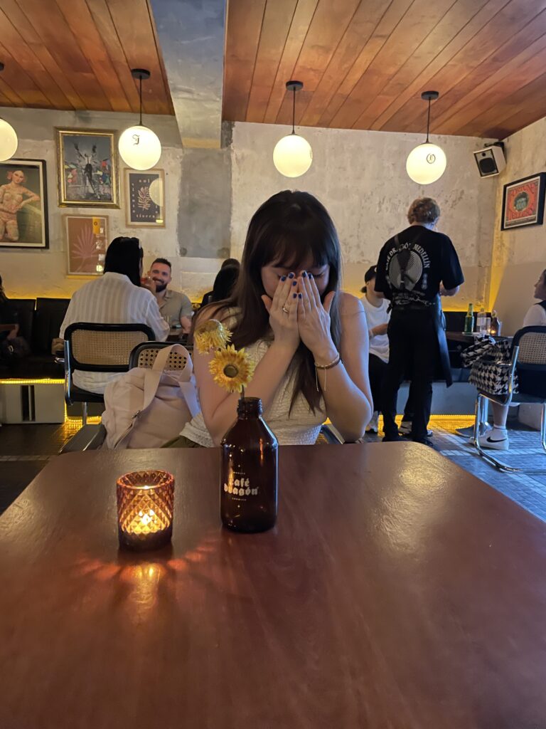 Where to Stay in Medellín: The Best Neighbourhoods for Every Kind of Traveller myself at cafe dragon in medellin colombia