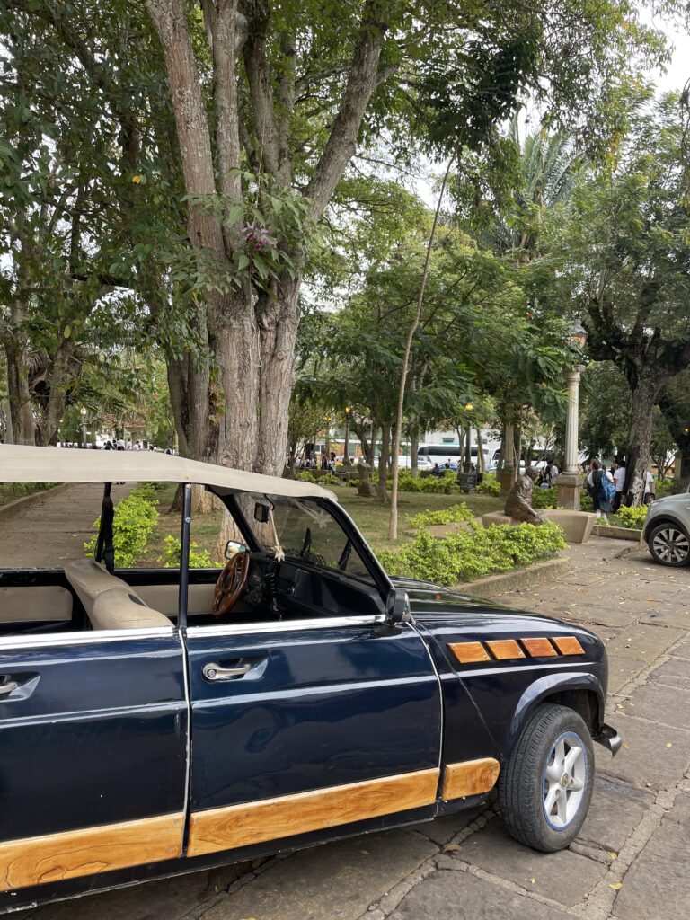 old car in barichara main square, colombia